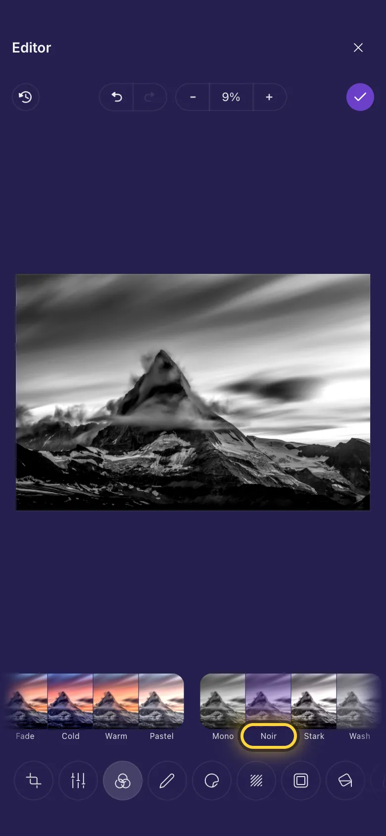 A mountain photo in black and white, with the Noir filter picked