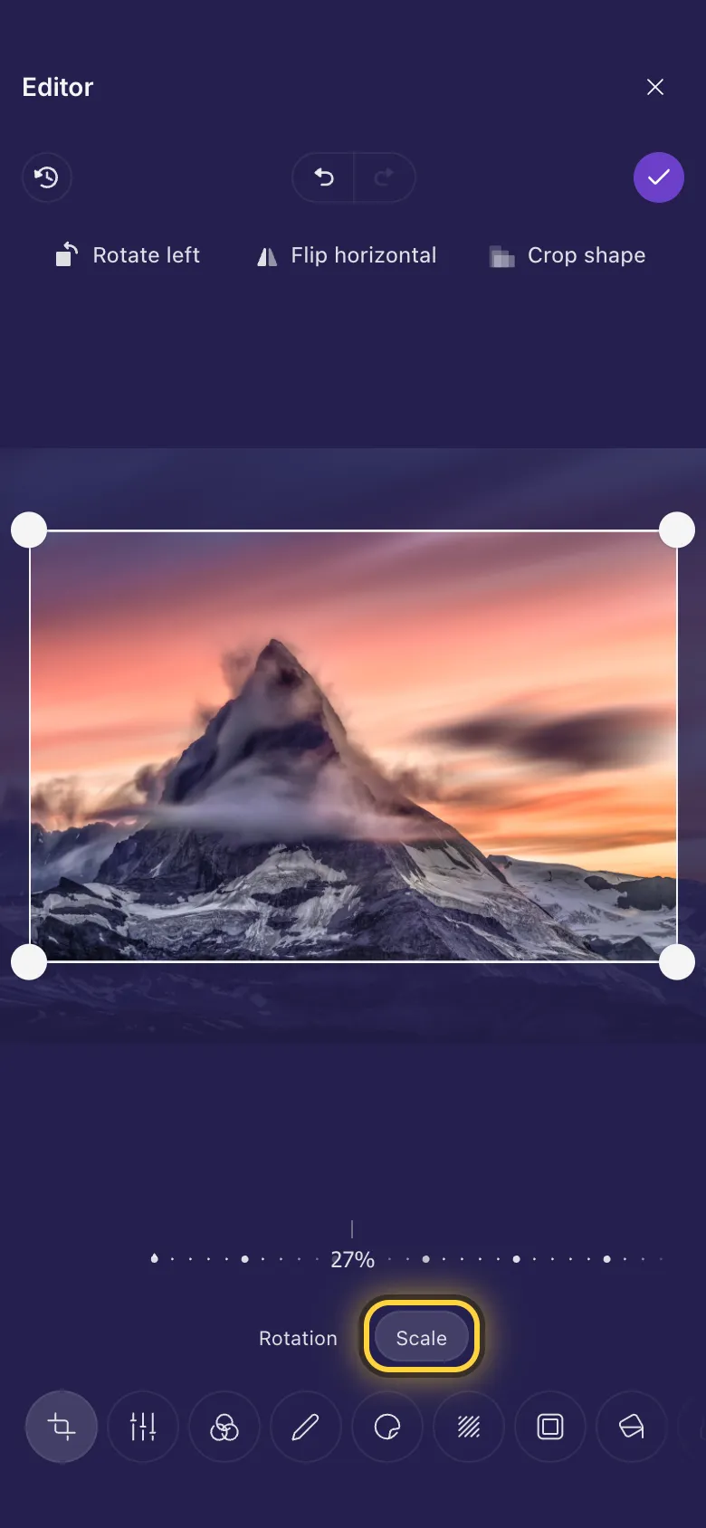 A mountain zoomed in inside the crop frame, with the zoom ruler under it